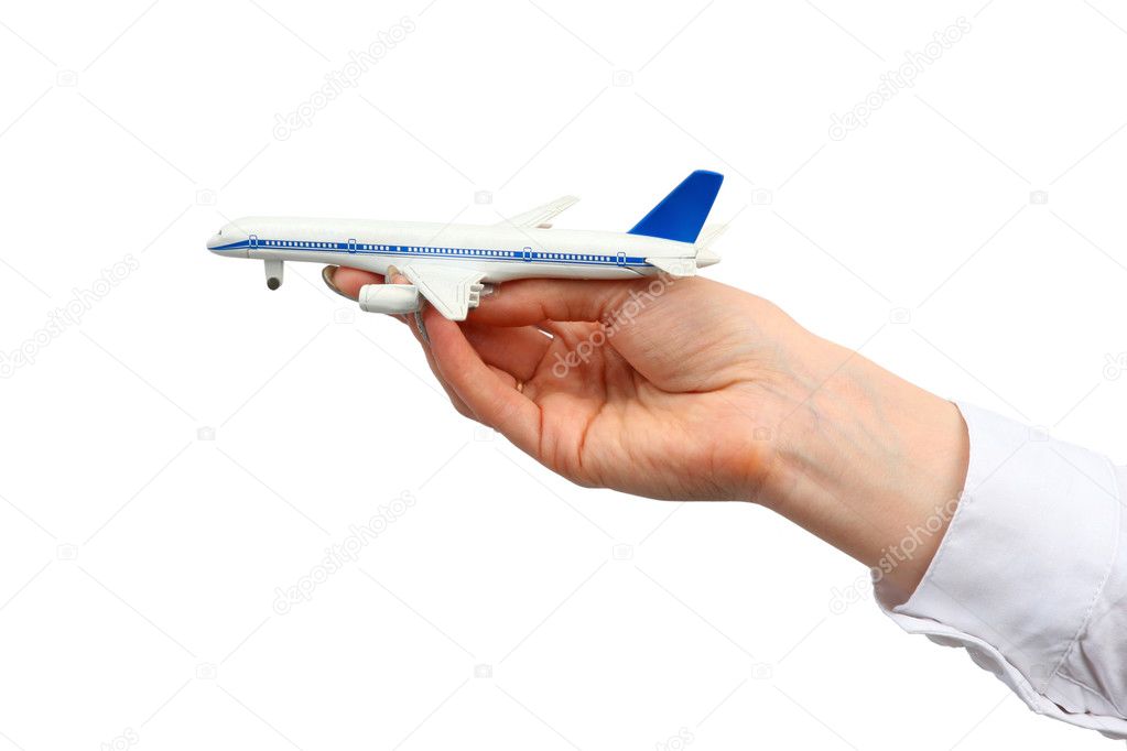 Toy airplane in hand.