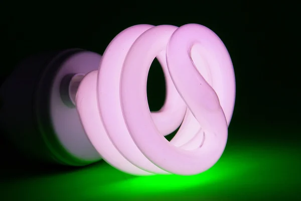 Power-saving light-bulb on green