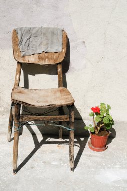 Vintage scene with very old chair clipart