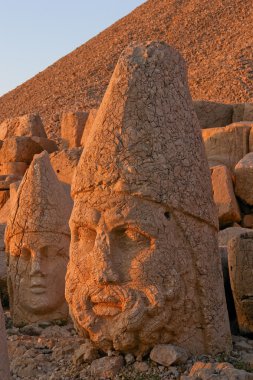 Heads of statues on Mount Nemrut Turkey clipart