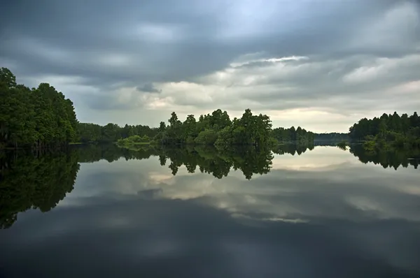 Mirrored River at Sunset