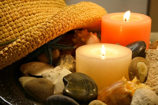 Hat, candles and rocks — Stock Photo, Image