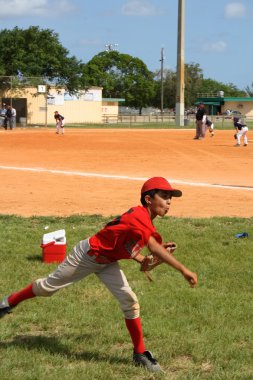 Child playing baseball clipart