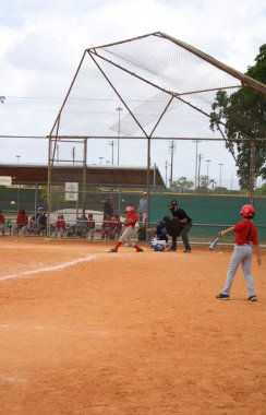 Child playing baseball clipart