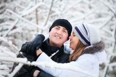 Young couple playing outdoors clipart