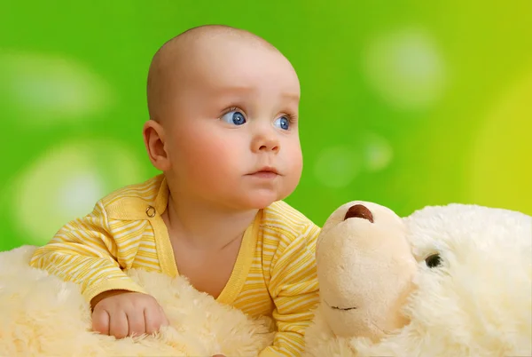 The baby and teddy bea — Stock Photo, Image
