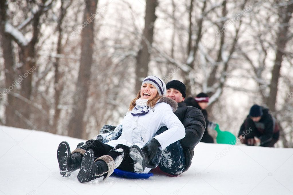 Couple riding a sleigh