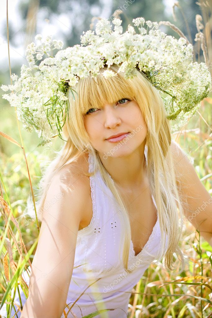 Pretty girl blonde on a lawn