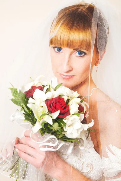 Bride peeking out from behind veil. — Stock Photo, Image