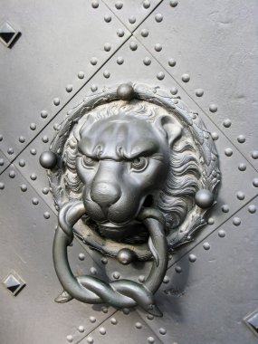 Old door with lion head clipart