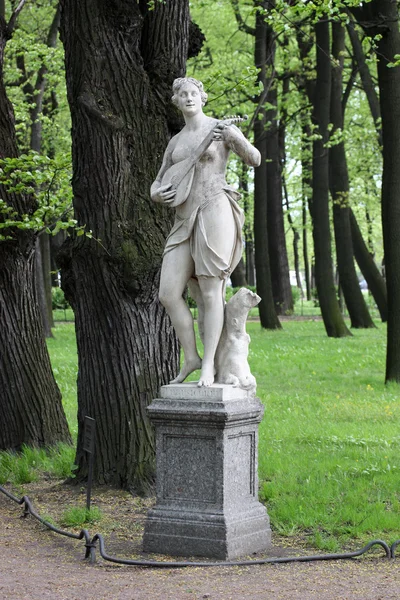 stock image Statue Terpsihore in a summer garden