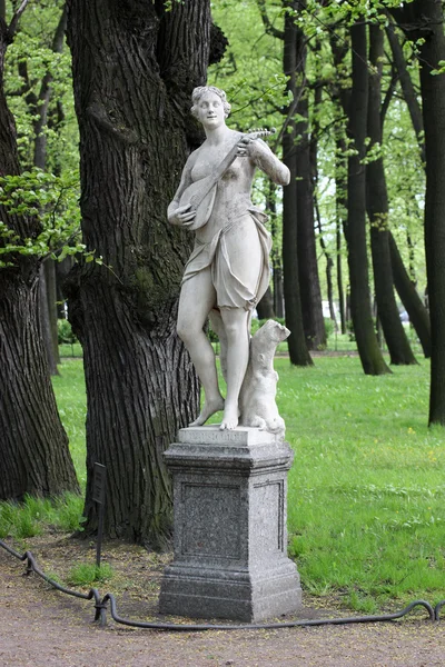 Stock image Statue Terpsihore in a summer garden