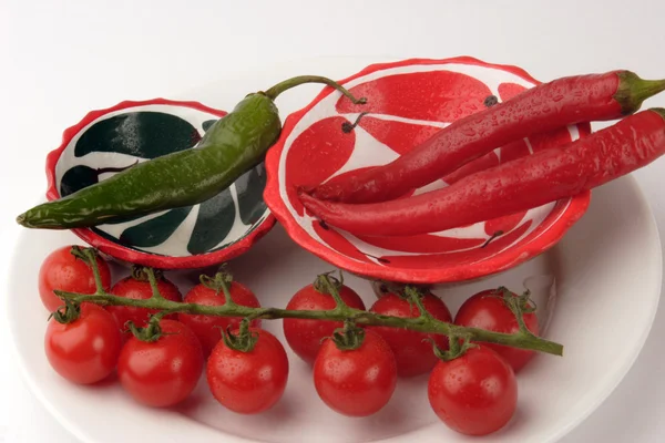 Chilli peppers and Cherry tomato's — Stock Photo, Image