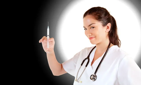 Krankenschwester mit Spritze schaut dich an — Stockfoto