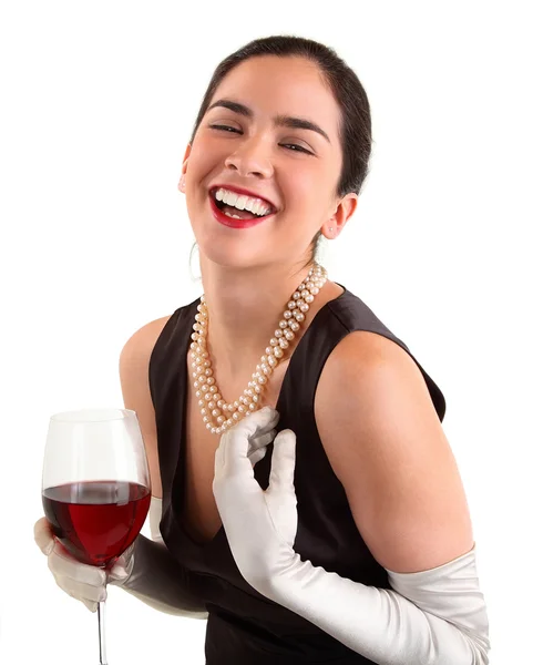 Frau hält ein Glas Wein Stockbild