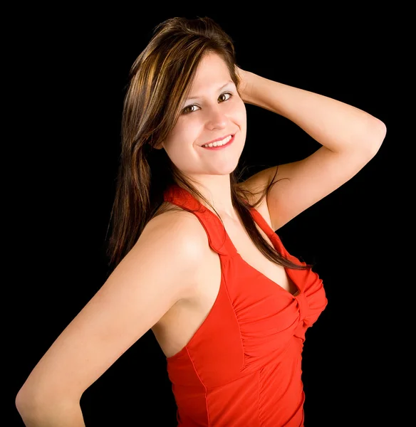Schöne lächelnde Dame in einem roten Kleid — Stockfoto