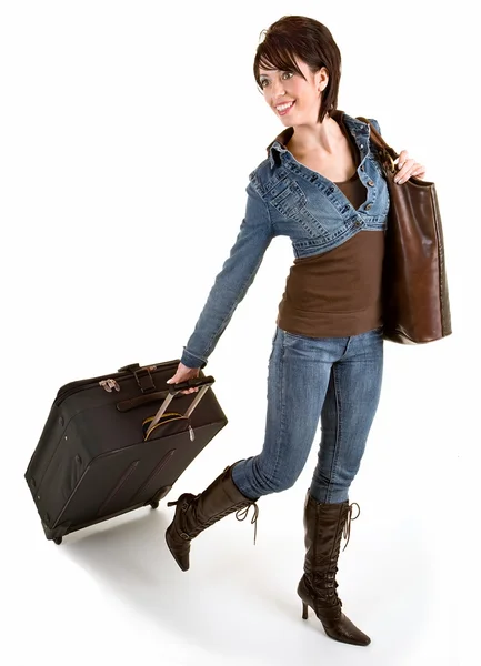 मुस्कुराते युवा लेडी अपना सामान खींच रहा है — स्टॉक फ़ोटो, इमेज