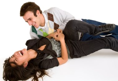 Young Girl being Tickled by Young Man clipart