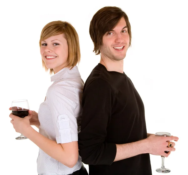 Νεαρό ζευγάρι που έχοντας κόκκινο κρασί — Φωτογραφία Αρχείου