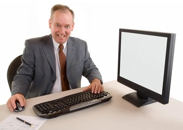 彼の机に座っているビジネスマン — ストック写真