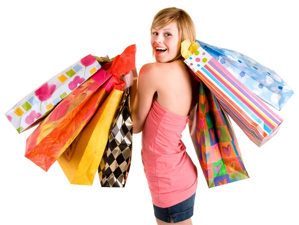 Giovane donna su una furia di shopping Fotografia Stock