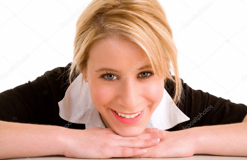 Smiling Woman Laying on her Desk