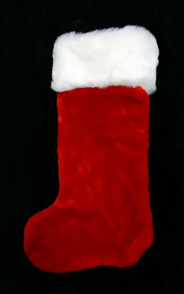 Christmas stocking op een zwarte achtergrond — Stockfoto