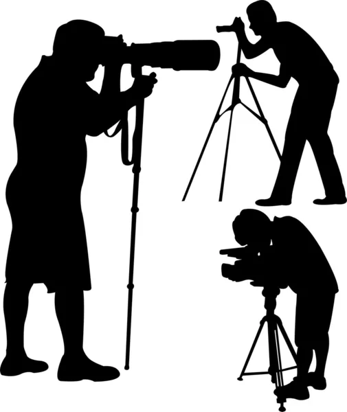 Силуэты фотографов — стоковый вектор