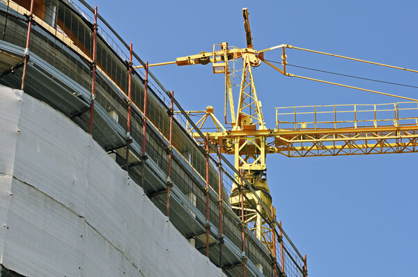 View of a new building with a yellow crane