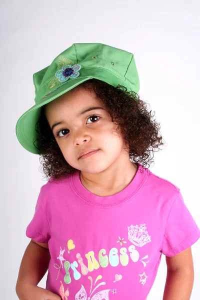 绿色帽子的女孩 免版税图库图片