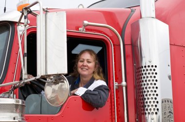 Woman driving an eighteen wheeler clipart