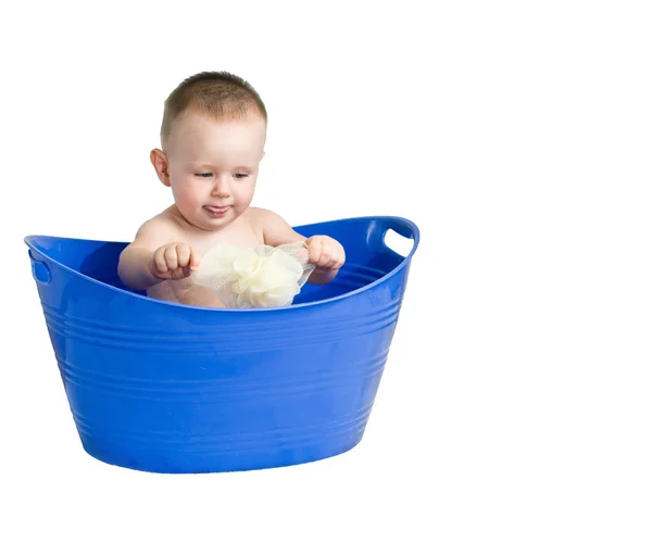 Dítě hrající v plastové vany — Stock fotografie