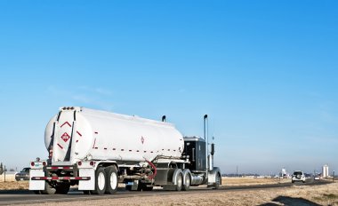 Independent trucker hauling fuel clipart