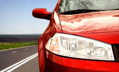 Green Sport car on a highway clipart