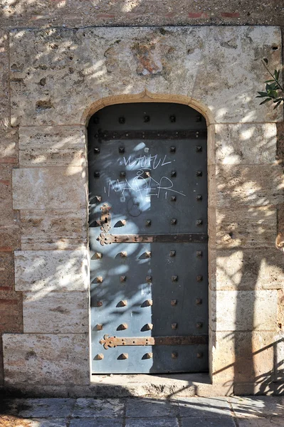 stock image Door of metal in medieval wall