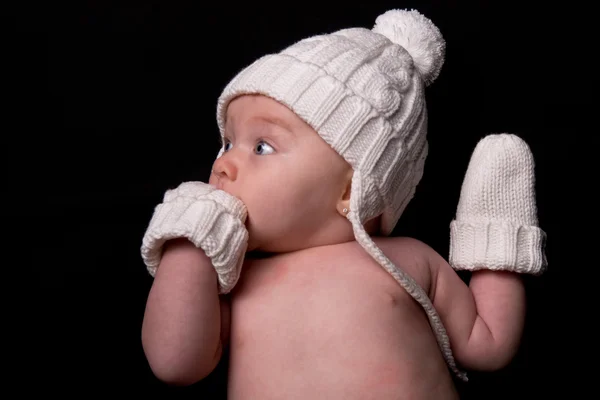 Baby in Hat and Mittens on Black — Stock Photo, Image