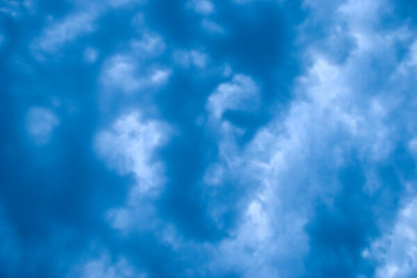 A photograph of a cloudy stormy sky, frame-filled to make an interested background texture.