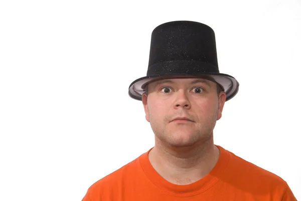 Man in hoed kijkt naar je met goofy gezicht — Stockfoto