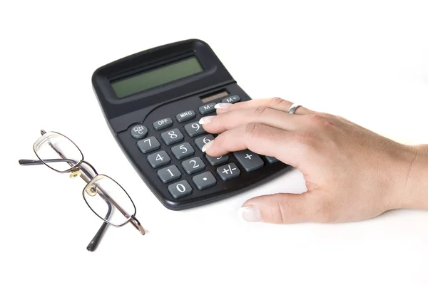 Ženská ruka na kalkulačce — Stock fotografie
