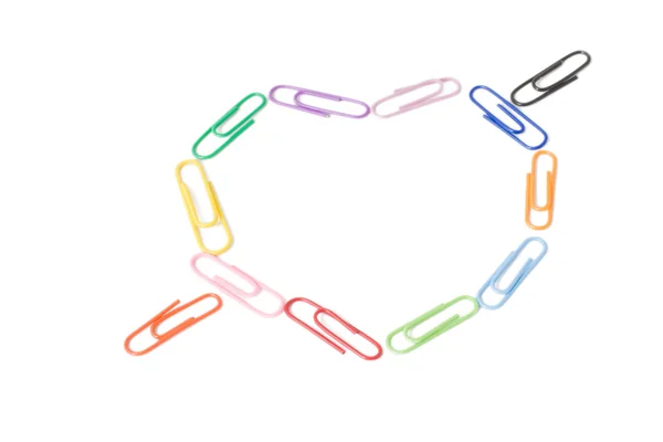 stock image Colorful paper clips in the form of a he