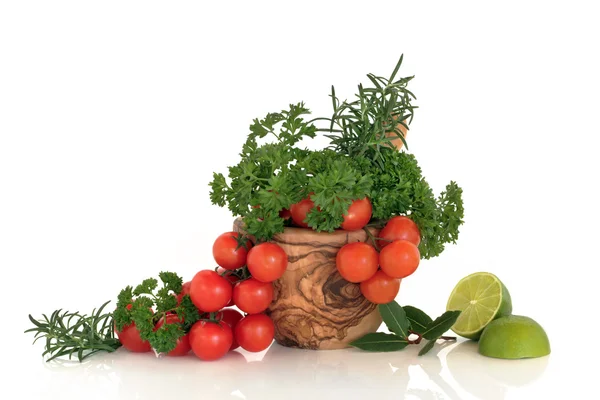 Rajčata, bylinky a limetky — Stock fotografie