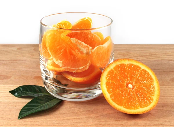 Glass with orange pieces — Stock Photo, Image
