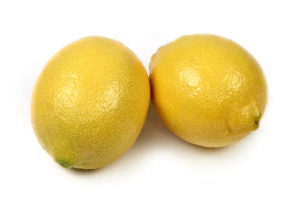 Два лимона, ізольовані — стокове фото