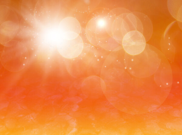 Magical background with sparkles, bokeh and star dust, orange gold colors