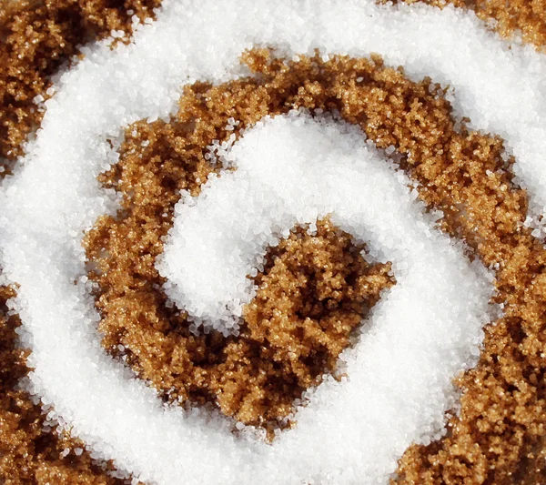 Spirale con zucchero bianco e marrone — Foto Stock