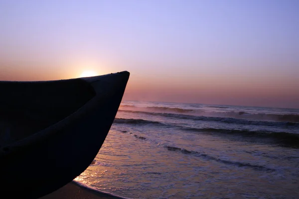 stock image Boat against the sunrise