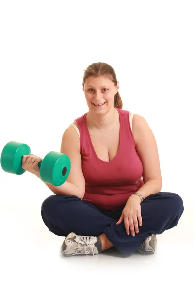 Jonge vrouw oefenen met gewichten — Stockfoto