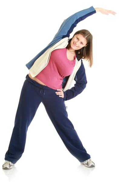 Vrouw geïsoleerde strekken over een whi passen — Stockfoto