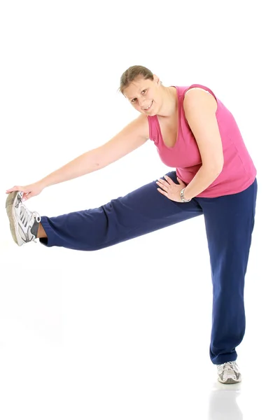Fit woman stretching isolated over a whi — Stock Photo, Image