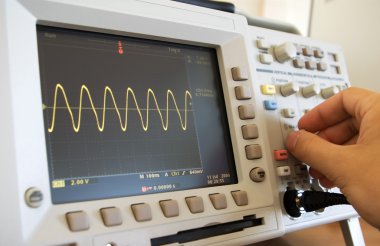 Sine wave on oscilloscope screen clipart